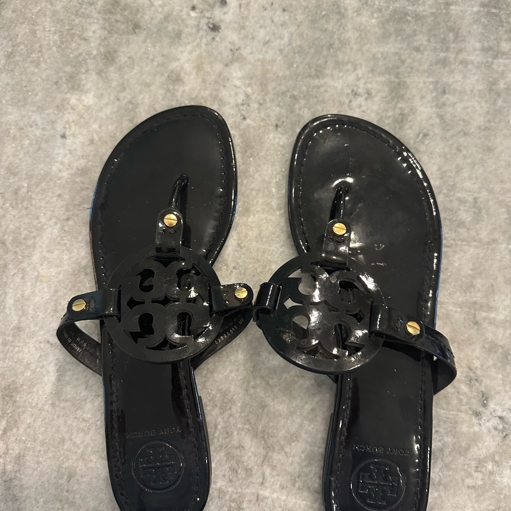 Tory Burch Black Sandals with Gold Medallion